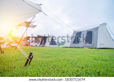 Close up of tent peg anchor on the ground tent,hook of tent,camping
