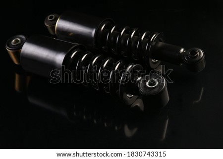 Spare parts for cars. on a black background. Selective focus Royalty-Free Stock Photo #1830743315