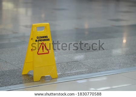 yellow sign of caution reserve cleaning on wet floor