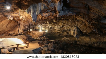 Beautiful and big cave has many rocks and stalactites which is called Tham Than Lot Noi in Chaloem Ratthanakosin National park, in  Kanchanaburi, Thailand. 