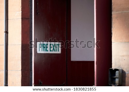 Fire exit keep clear sign on construction building site door