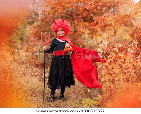 Full length picture of a girl in a Halloween devil costume