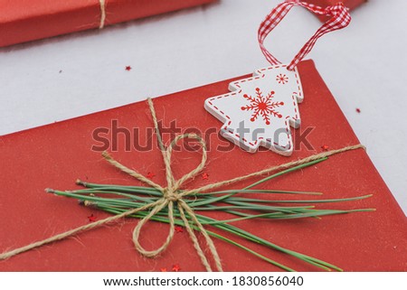 Detail of a red christmas gift. Christmas composition. Christmas background. Selective focus. Close up view.