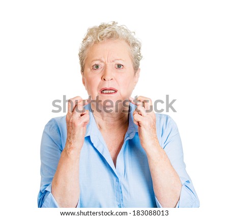 Closeup portrait senior mature woman crossing her fingers, hoping for best future, looking at you, in anticipation for life changer, isolated white background. Human emotions, facial expressions