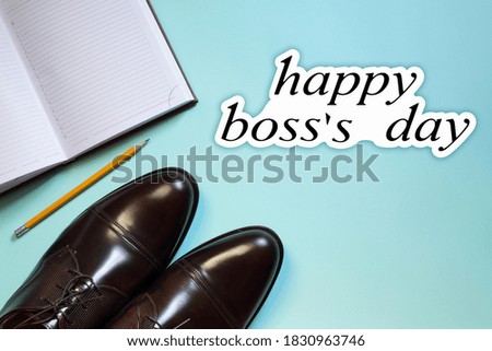 Happy Boss`s Day concept, banner, card, poster. Leather luxury shoes, diary and pencil on a blue background. Place for text.