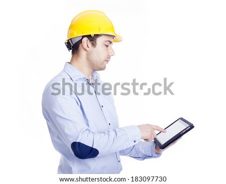 Handsome engineer working with a tablet pc, isolated on white