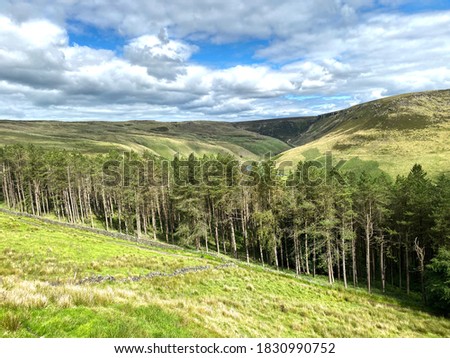 Landscape view, from the A635 Holmfirth road, with valleys, trees, and distant hills in, Oldham, Lancashire, UK