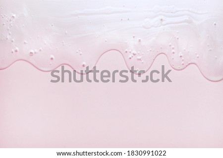 Cream gel light pink transparent cosmetic sample texture with bubbles isolated on white background