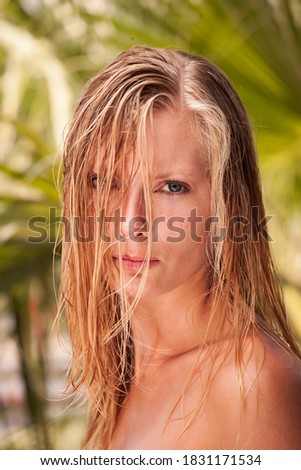 Beautiful blonde woman at the tropical resort