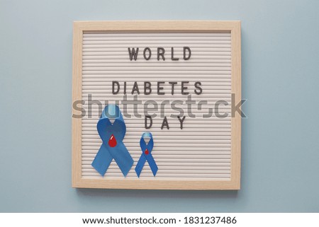 World Diabetes Day with blue ribbons on letter board