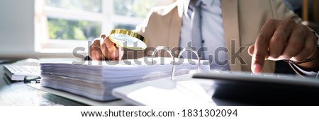 IRS Tax Audit. African Auditor Doing Debt Fraud Inspection Royalty-Free Stock Photo #1831302094