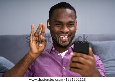 Deaf African Man With Disabilities Using Video Conference