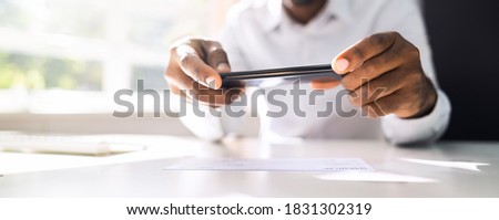 Remote Check Deposit Using Mobile Photo Scanning Royalty-Free Stock Photo #1831302319