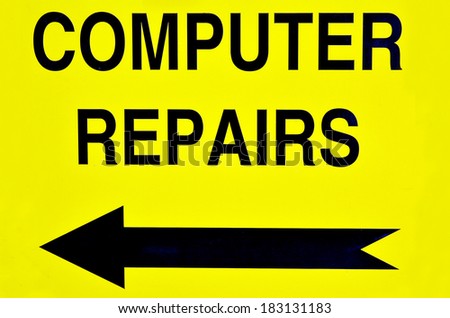 Computer repairs road sign with direction arrow.  Concept photo of computer repairs, business, problem,advice,maintenance and malfunction.
