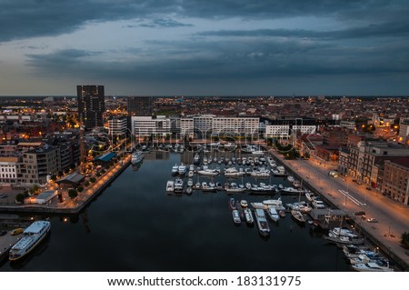 Aerial view to the harbor of Antwerp from the roof of MAS Museum in evening, Belgium. Royalty-Free Stock Photo #183131975