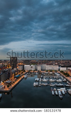 Aerial view to the harbor of Antwerp from the roof of MAS Museum in evening, Belgium. Royalty-Free Stock Photo #183131978
