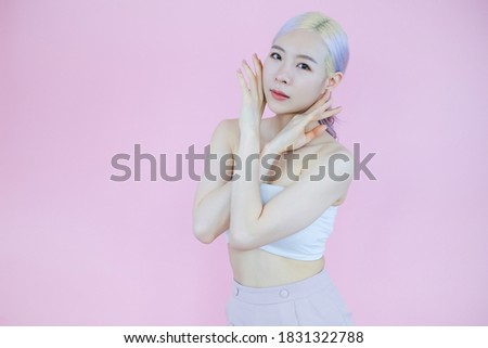 posing beautiful asian woman posing on pink background, emotions action, beauty concept