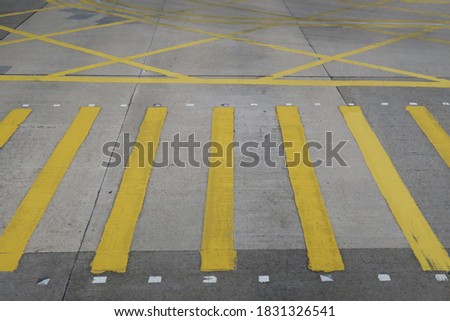 Yellow crosswalk and grid on the road in Hong Kong