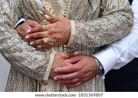 picture of man and woman with wedding ring.moroccan wedding.Wedding henna