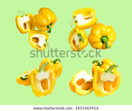 Yellow bell pepper isolated in pastel green background with clipping path, no shadow, slices, half