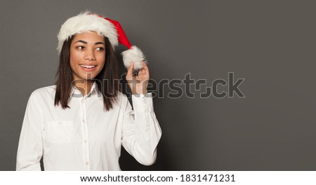 Christmas woman Santa on gray background