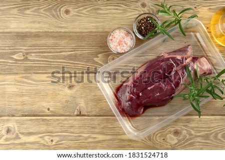 raw skirt-steak vacuum with rosemary and spices