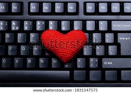 heart symbol on a black computer keyboard background. online dating conceptual.