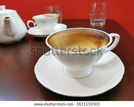 empty white cup of coffee after finished drinking