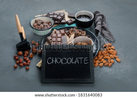 Delicious chocolate bars and pieces with nuts. 