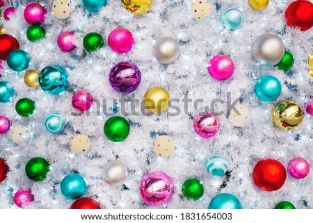 Christmas decoration background series - beautiful white Christmas tree closeup with multiple colours ornaments and lighting 