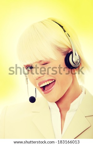 Call center woman with headset.  Over abstract green background 