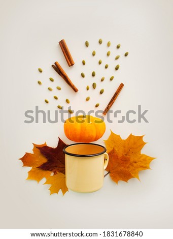 Festive autumn background with pumpkin, leaves and cup on a white background. Concept of Thanksgiving day or Halloween. Flat lay autumn composition