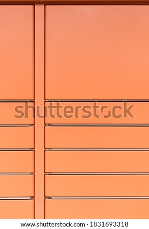 Post office box. Orange post box for rentals. Post box lockers for parcels that the recipient can pick up there. Pack station.