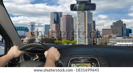 Driving a car towards the scenic skyline of Boston, Massachusetts, USA