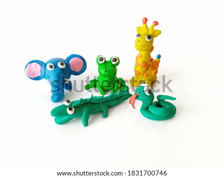 plasticine of animals wild of frog,elephant,giraffe,snake  and crocodile isolated on white background.