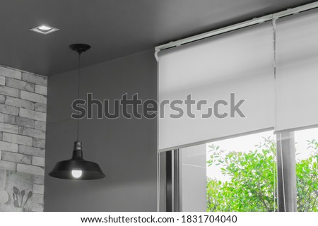 close up white roller blinds or curtain on the glass wall Royalty-Free Stock Photo #1831704040