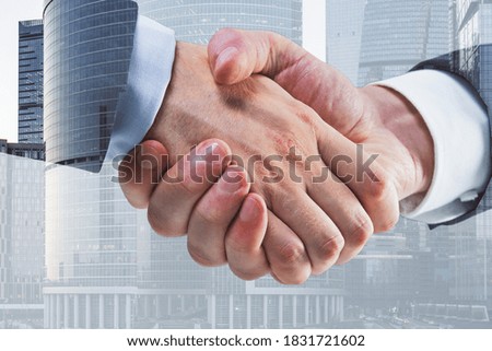 Businessmen shaking hands on blurry city background. Teamwork and success concept. Multiexposure
