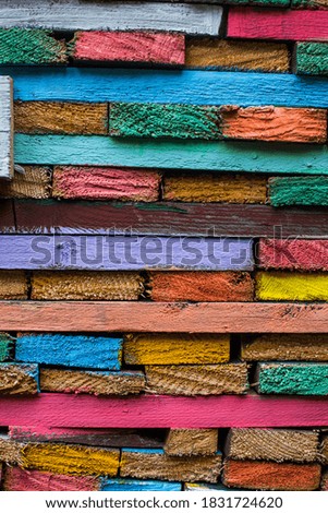 Close up shot of some wood planks painted in various colors, background concept. 