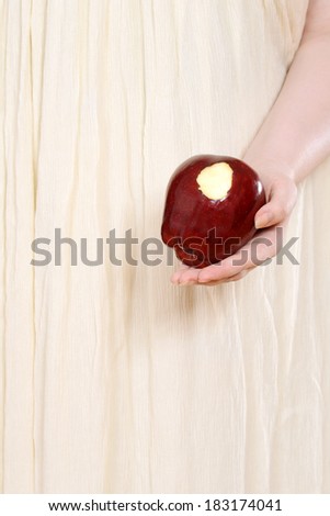 closeup woman holding red apple