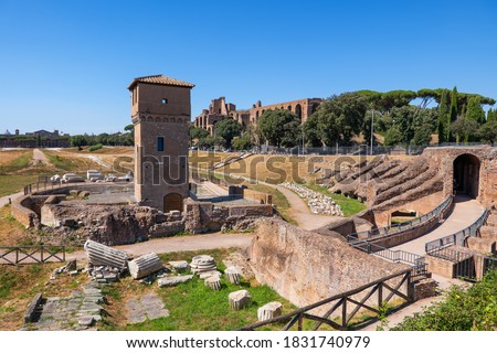 Circus Maximus (Italian: Circo Massimo) ancient stadium ruins and medieval Tower of Moletta in city of Rome, Italy Royalty-Free Stock Photo #1831740979
