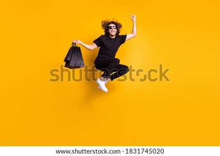 Full length body size portrait of man jumping shouting loudly celebrating great discount on black friday sale isolated on bright yellow color background Royalty-Free Stock Photo #1831745020