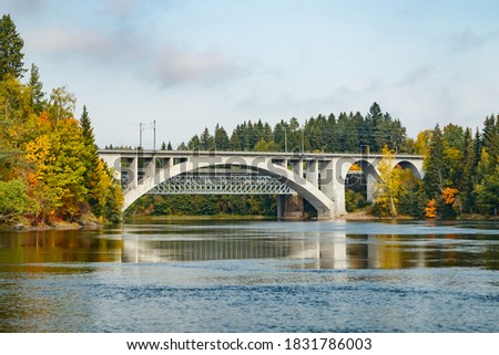Autumn landscape of bridge and Kymijoki river waters in Finland, Kouvola, Koria Royalty-Free Stock Photo #1831786003