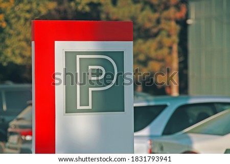 Parking sign. Symbol on a cars and tree background. Street sign for permission to park vehicles.