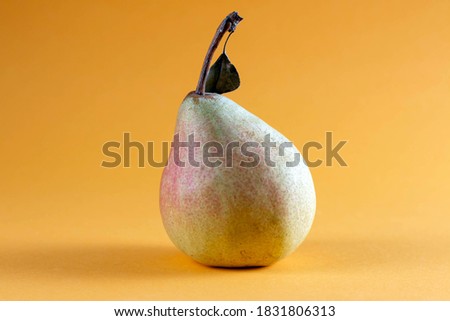 Organic pear on a yellow background. Pear decoration stock images. Pear home decor.