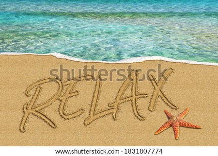 Word Relax written On the Beach
