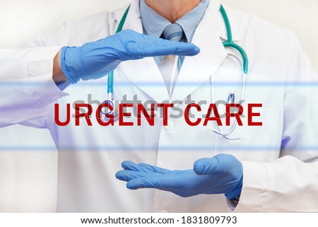 Doctor's hands with URGENT CARE inscription. Medical concept