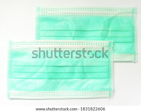 Green surgical face mask on white background,  Health care concept and can protect virus covid-19, medical masks, fabric mask, protect air pollution