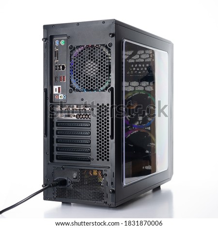 Studio shot of black Gaming desktop pc with rgb lights and visible components. Isolated on white background. Royalty-Free Stock Photo #1831870006