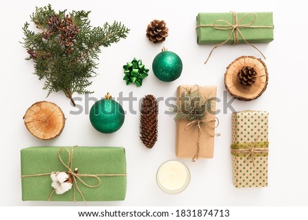 Christmas flat lay composition with zero waste crafted gifts on white Background. New year and merry christmas festive presents