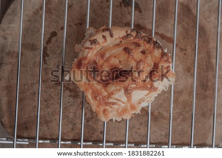 Piece of pizza in the tray on with wooden background